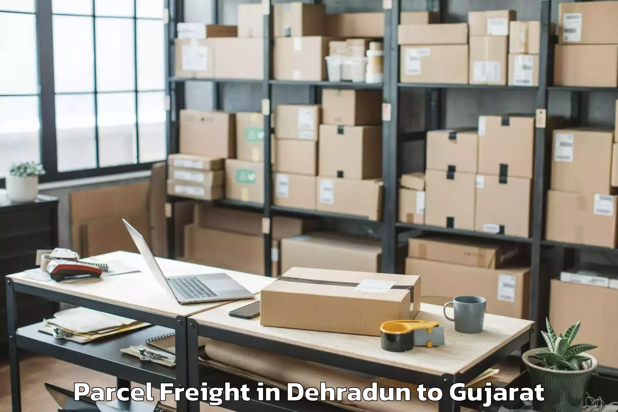 Book Dehradun to Adalaj Parcel Freight